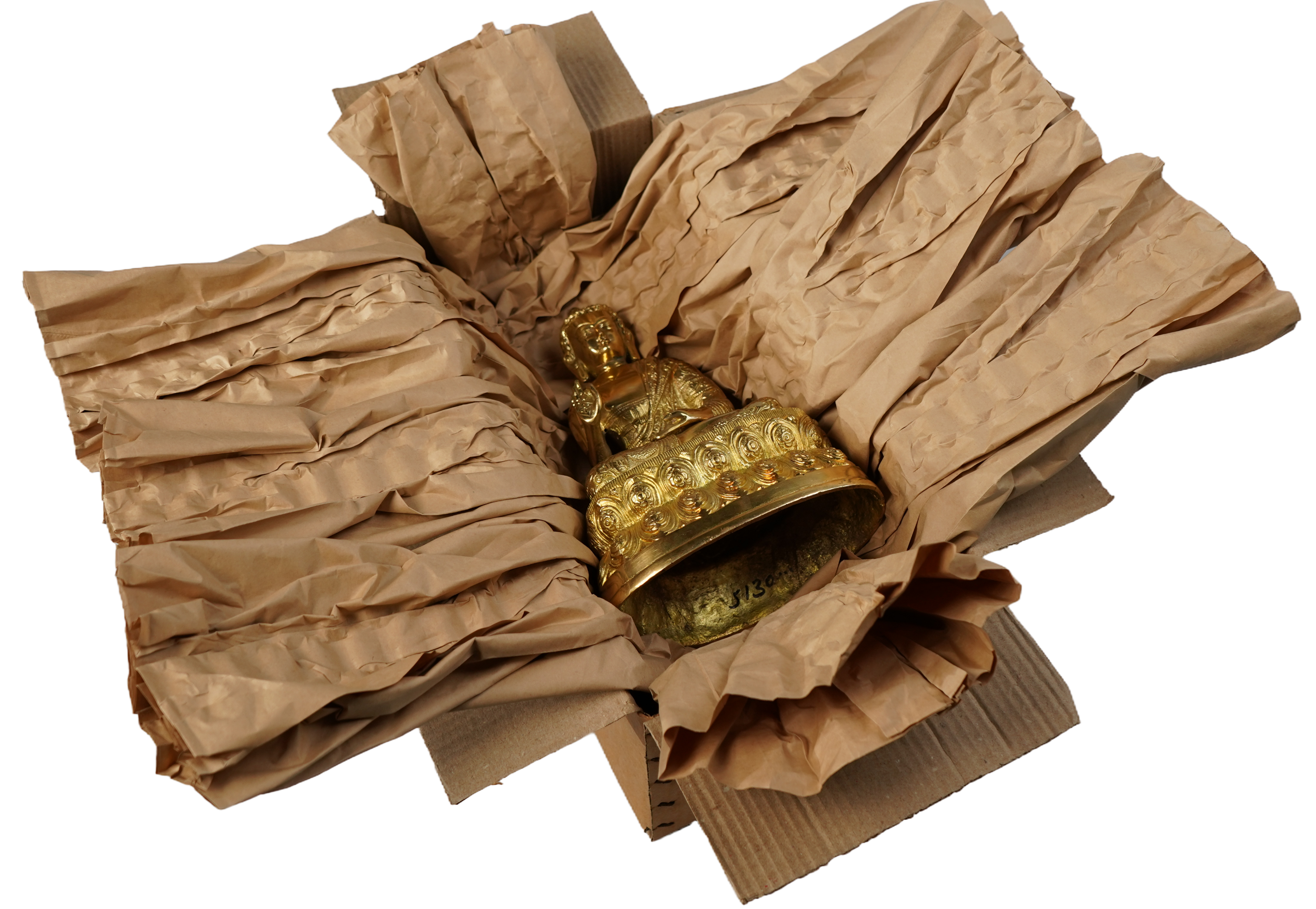 Buddha idol wrapped in paper packaging